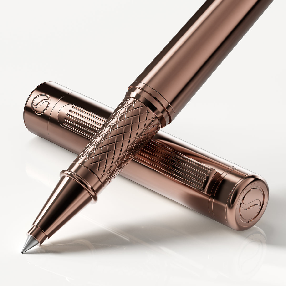 Rose gold pen with detailed design on a white background